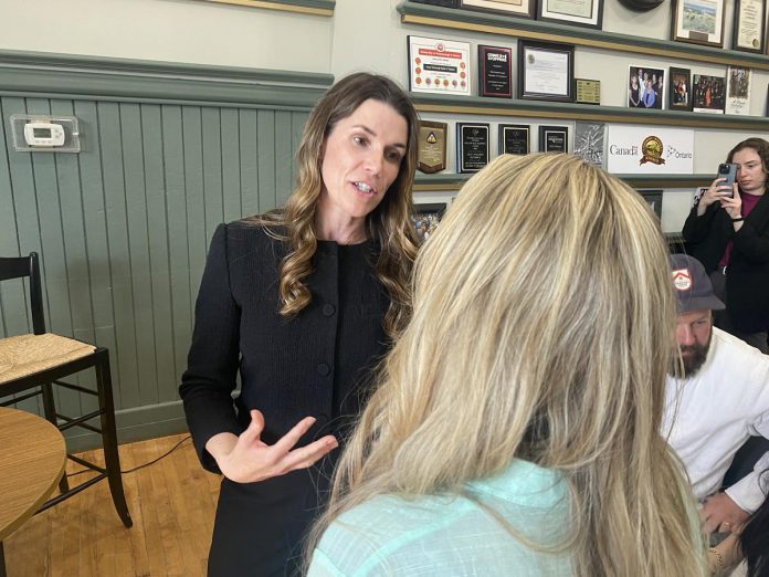 Peterborough MP Emma Harrison speaks with an attendee at event featuring federal transport minister Steven MacKinnon that was hosted by the Peterborough and Kawarthas Chamber of Commerce on May 8, 2026. (Photo: Paul Rellinger / kawarthaNOW)