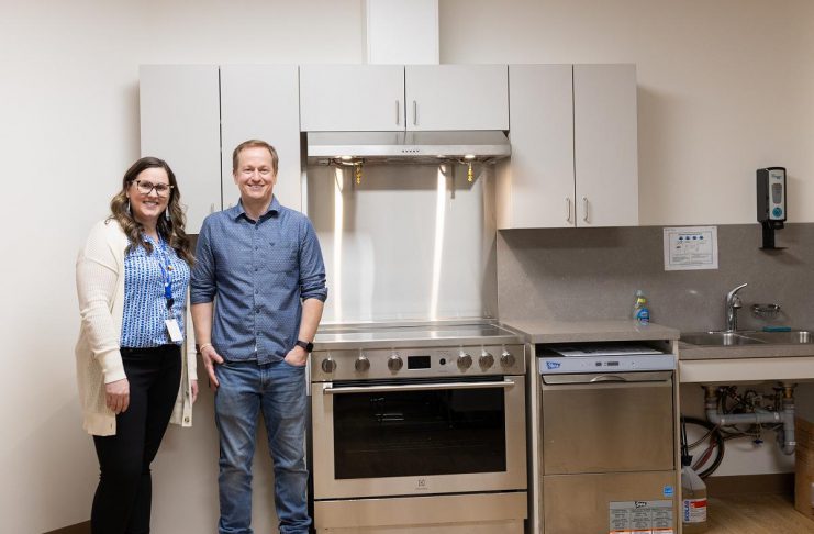Peterborough Community Health Centre executive director Ashley Safar with Craig Mortlock, co-owner of MCI Constructors Inc., which donated $30,000 to the centre to fund the full outfitting of a new community kitchen and the purchase and installation of a washer and dryer. The new additions will allow the centre to address immediate needs of its clients from marginalized communities as well as improve the centre's ability to provide wraparound community-based care. (Photo courtesy of Peterborough Community Health Centre)