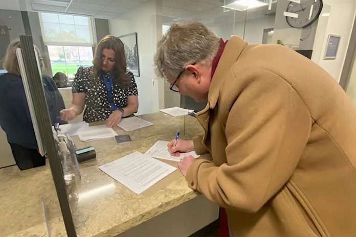 Dr. Michael Eamon filing his nomination papers as a mayoral candidate in the 2026 municipal election at the clerk's office at Peterborough City Hall on Friday, May 1. (Photo: Paul Rellinger / kawarthaNOW)