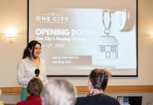 Tammy Kuehne, acting executive director of One City Peterborough, speaks to attendees at an event to discuss the non-profit organization's housing strategy at Knights of Columbus Hall on May 12, 2026. (Photo: Jordan Lyall / kawarthaNOW)