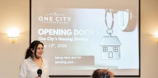 Tammy Kuehne, acting executive director of One City Peterborough, speaks to attendees at an event to discuss the non-profit organization's housing strategy at Knights of Columbus Hall on May 12, 2026. (Photo: Jordan Lyall / kawarthaNOW)