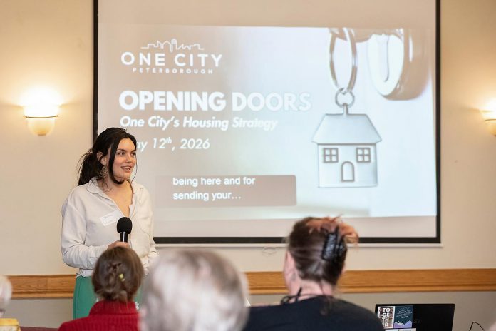 Tammy Kuehne, acting executive director of One City Peterborough, speaks to attendees at an event to discuss the non-profit organization's housing strategy at Knights of Columbus Hall on May 12, 2026. (Photo: Jordan Lyall / kawarthaNOW)