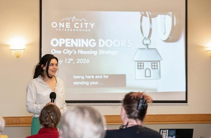 Tammy Kuehne, acting executive director of One City Peterborough, speaks to attendees at an event to discuss the non-profit organization's housing strategy at Knights of Columbus Hall on May 12, 2026. (Photo: Jordan Lyall / kawarthaNOW)
