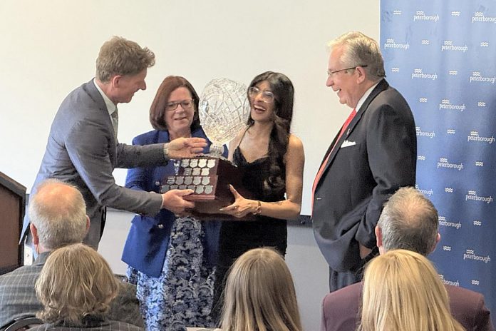 Peterborough city clerk John Kennedy presents Jenisha Sanjit Arora with the Youth Volunteer of the Year award during the 2025 Civic Awards ceremony at the McDonnel Street Community Centre on May 21, 2026 as city councillor Lesley Parnell and Mayor Jeff Leal look on. (Photo: City of Peterborough) Peterborough city clerk John Kennedy presents Jenisha Sanjit Arora with the Youth Volunteer of the Year award during the 2025 Civic Awards ceremony at the McDonnel Street Community Centre on May 21, 2026 as city councillor Lesley Parnell and Mayor Jeff Leal look on. (Photo: City of Peterborough)