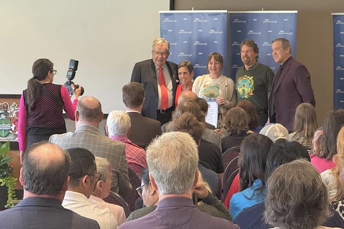 Peterborough Folk Festival 2025 board members Carol Lawless, Rebecca Schillemat, and chair Rob Davis pose for a photo with Mayor Jeff Leal and city councillor Matt Crowley after the board received a Cultural Betterment award during the 2025 Civic Awards ceremony at the McDonnel Street Community Centre on May 21, 2026. (Photo: City of Peterborough