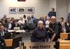 An irate member of the public shouts at councillors during a debate on a winter shelter response plan for homelessness at city council's general committee meeting on May 25, 2026. (kawarthaNOW screenshot of City of Peterborough video)