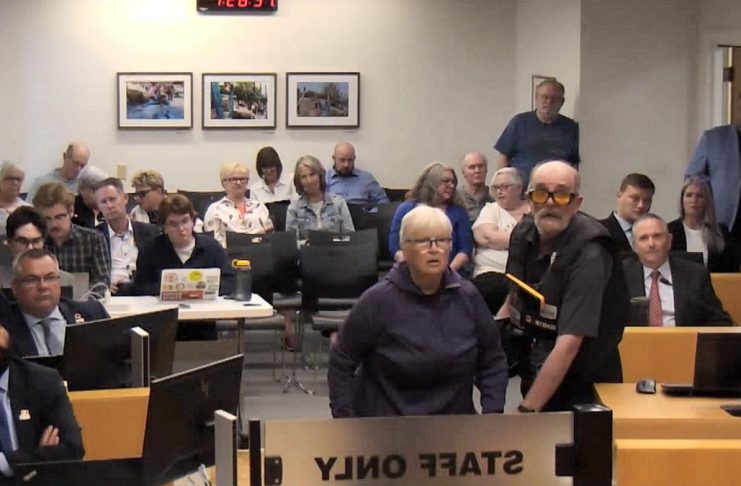 Peterborough city council endorses deferring winter shelter response plan until August Peterborough resident Margie Sumadh shouts at councillors during a debate on a winter shelter response plan for homelessness at city council's general committee meeting on May 25, 2026. She was irate with the way unhoused people are being treated in the city. (kawarthaNOW screenshot of City of Peterborough video)