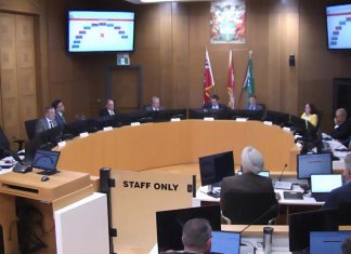 At Peterborough city council's general committee meeting on May 4, 2026, a motion to defer Mayor Leal's motion to commit the city to financing $57 million of the cost of a proposed $170-million sport and event centre in downtown Peterborough failed 6-4, with councillor Alex Bierk absent from the meeting. Councillors later approved the mayor's motion. (kawarthaNOW screenshot of City of Peterborough video)