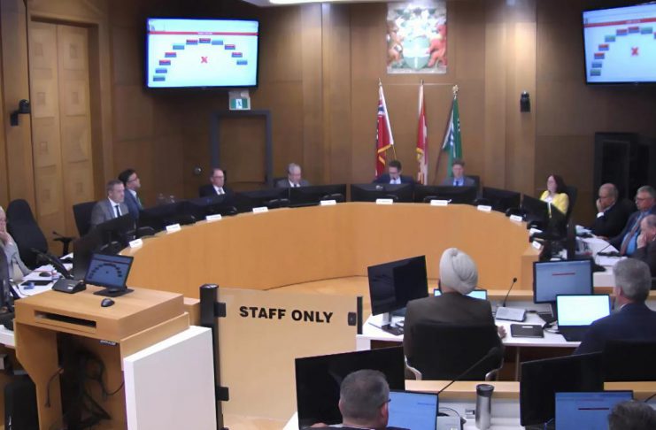 At Peterborough city council's general committee meeting on May 4, 2026, a motion to defer Mayor Leal's motion to commit the city to financing $57 million of the cost of a proposed $170-million sport and event centre in downtown Peterborough failed 6-4, with councillor Alex Bierk absent from the meeting. Councillors later approved the mayor's motion. (kawarthaNOW screenshot of City of Peterborough video)