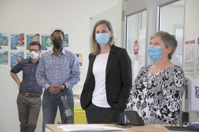 Lakelands Public Health medical officer of health Dr. Thomas Piggott (left) with PARN executive director Dane Record (second from left) during a May 2022 media tour prior to the opening of Peterborough's Consumption and Treatment Site (CTS) on Simcoe Street in downtown Peterborough. Also pictured are CTS program manager Kerri Kightley and Fourcast executive director Donna Rogers. (Photo: Jeannine Taylor / kawarthaNOW) Lakelands Public Health medical officer of health Dr. Thomas Piggott (left) with PARN executive director Dane Record (second from left) during a May 2022 media tour prior to the opening of Peterborough's Consumption and Treatment Site (CTS) on Simcoe Street in downtown Peterborough. Also pictured are CTS program manager Kerri Kightley and Fourcast executive director Donna Rogers. (Photo: Jeannine Taylor / kawarthaNOW)