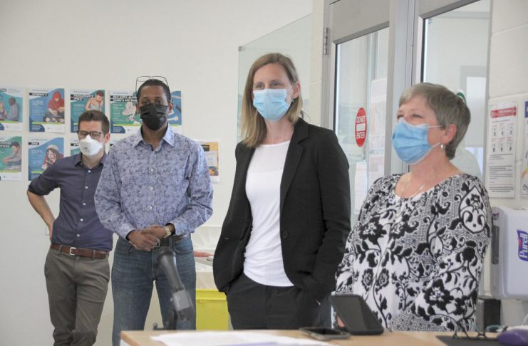 ‘It’s not a hypothetical’: Medical officer of health says Peterborough CTS closure will drive more overdoses to ER Lakelands Public Health medical officer of health Dr. Thomas Piggott (left) with PARN executive director Dane Record (second from left) during a May 2022 media tour prior to the opening of Peterborough's Consumption and Treatment Site (CTS) on Simcoe Street in downtown Peterborough. Also pictured are CTS program manager Kerri Kightley and Fourcast executive director Donna Rogers. (Photo: Jeannine Taylor / kawarthaNOW)