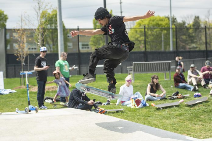 A skateboarder catches air during a day-long celebration of the expanded skatepark in Peterborough's Bonnerworth Park on May 16, 2026. (Photo: Mike Quigg)
