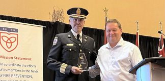 Port Hope fire chief Jason Williams receiving the 2026 Fire Chief of the Year award from Ontario Municipal Fire Prevention Officers Association vice-president Don Casey on May 27, 2026 at the association's 69th annual symposium training and education symposium at Casino Rama in Orillia. (Photo via Municipality of Port Hope)