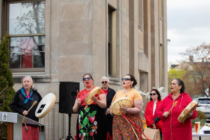 Members of Naandewegaan (Healing With Drums) performing during an event to commemorate Red Dress Day at Peterborough City Hall on May 5, 2026. (Photo: Jordan Lyall / kawarthaNOW)