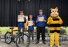 The top three spellers of the intermediate division (grades 7 and 8) at the Rotary Club of Peterborough's 12th annual spelling bee on May 2, 2026 at Whetung Theatre at Fleming College: Henry Sharpe from Adam Scott Intermediate Public School, Hudson Inglis of Kawartha Classical Christian School, and Tyler Phillips of St. Teresa Catholic Elementary School. Along with the top three spellers from the junior division (grades 4 to 6), the students won prizes including bikes from Canadian Tire. (Photo courtesy of Rotary Club of Peterborough)