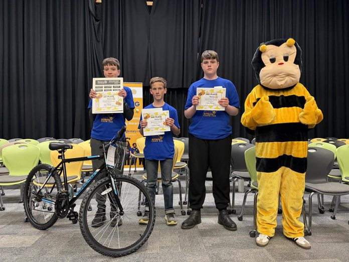 The top three spellers of the intermediate division (grades 7 and 8) at the Rotary Club of Peterborough's 12th annual spelling bee on May 2, 2026 at Whetung Theatre at Fleming College: Henry Sharpe from Adam Scott Intermediate Public School, Hudson Inglis of Kawartha Classical Christian School, and Tyler Phillips of St. Teresa Catholic Elementary School. Along with the top three spellers from the junior division (grades 4 to 6), the students won prizes including bikes from Canadian Tire. (Photo courtesy of Rotary Club of Peterborough)