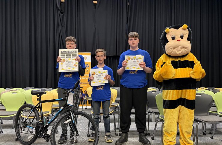The top three spellers of the intermediate division (grades 7 and 8) at the Rotary Club of Peterborough's 12th annual spelling bee on May 2, 2026 at Whetung Theatre at Fleming College: Henry Sharpe from Adam Scott Intermediate Public School, Hudson Inglis of Kawartha Classical Christian School, and Tyler Phillips of St. Teresa Catholic Elementary School. Along with the top three spellers from the junior division (grades 4 to 6), the students won prizes including bikes from Canadian Tire. (Photo courtesy of Rotary Club of Peterborough)