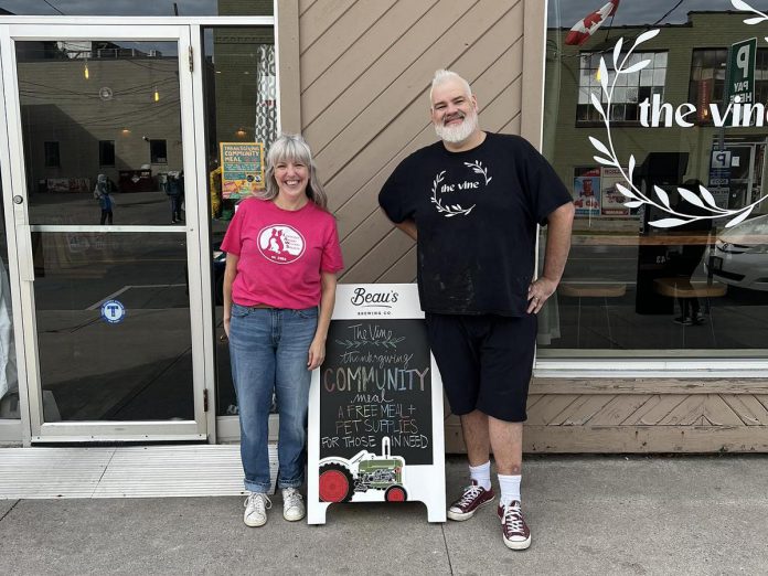 Lyndsay Lisson-De Ell, director of operations at the Lakefield Animal Welfare Society, and Tyrone Flowers, owner of The Vine in Peterborough, when they partnered to distribute a Thanksgiving community meal and pet food and supplies to those in need in October 2025. Since its founding in 2023, the restaurant has frequently shown up for the community by engaging in local events and initiatives, partnering with local organizations, and hosting a weekly community meal to fight local food insecurity. (Photo courtesy of The Vine)
