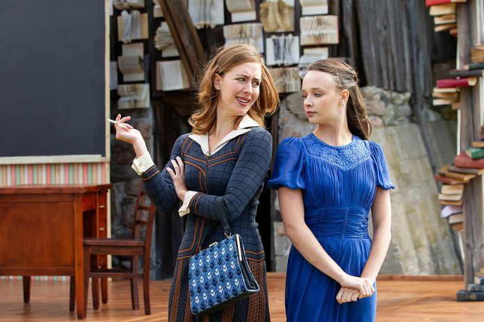 Rainbow Kester and Alex Pearce as teachers Evie Bothwell and Melita Linton in a scene from Leanna Brodie's play "Schoolhouse" during a media day event on June 17, 2026 hosted by 4th Line Theatre at Winslow Farm near Millbrook. The play, which runs from June 30 to July 25, tells the story of the newly graduated Miss Linton as she teaches in a one-room school near the fictional village of Baker's Creek in 1938 and deals with a withdrawn boy recently released from reform school. (Photo: Jordan Lyall / kawarthaNOW) Rainbow Kester and Alex Pearce as teachers Evie Bothwell and Melita Linton in a scene from Leanna Brodie's play "Schoolhouse" during a media day event on June 17, 2026 hosted by 4th Line Theatre at Winslow Farm near Millbrook. The play, which runs from June 30 to July 25, tells the story of the newly graduated Miss Linton as she teaches in a one-room school near the fictional village of Baker's Creek in 1938 and deals with a withdrawn boy recently released from reform school. (Photo: Jordan Lyall / kawarthaNOW)