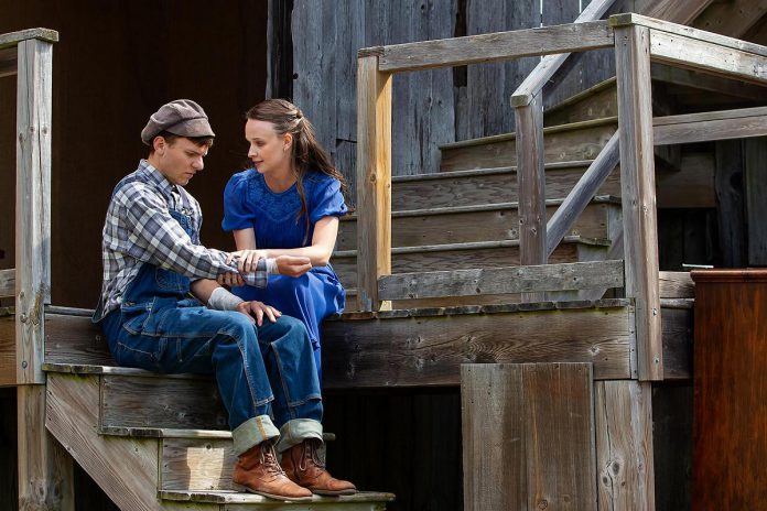 Alex Pearce (right) as teacher Melita Linton comforting Alexei DeLuca as troubled student Ewart in a scene from Leanna Brodie's play "Schoolhouse" during a media day event on June 17, 2026 hosted by 4th Line Theatre at Winslow Farm near Millbrook. (Photo: Jordan Lyall / kawarthaNOW)