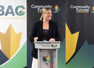 Community Futures Peterborough executive director Devon Girard at the podium during the not-for-profit economic development organization's annual general meeting on June 23, 2026 at the Venture North building in downtown Peterborough. (Photo courtesy of Community Futures Peterborough)