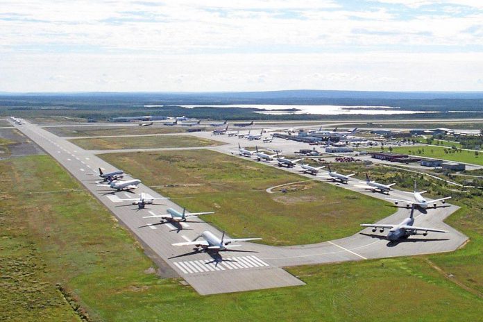 Planes line up on the runway of the Gander airport in Newfoundland after they were diverted following the terrorist attacks on the United States on September 11, 2001. Thirty-eight planes carried almost 6,600 passengers and crew. Residents took care of the stranded passengers for days and many have remained in touch with them since. (Photo: Nav Canada)