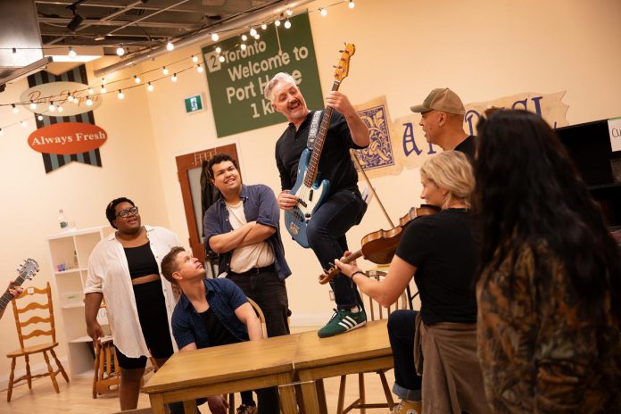 The cast during a rehearsal of the Capitol Theatre's production of "Come From Away" at the historic venue in Port Hope from July 10 to August 9, 2026. (Photo: Sam Moffatt)