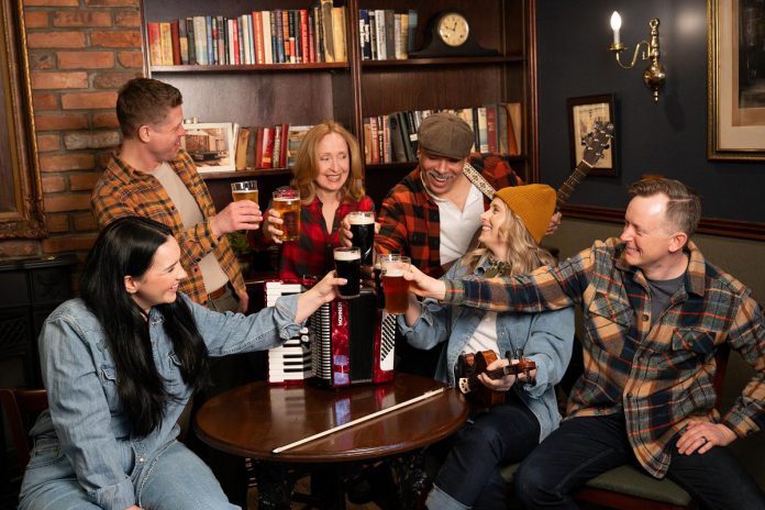 Julie Lumsden, Kyle Golemba, Donna Garner, Beau Dixon, Melissa Payne, and Kyle Blair in a promotional shot for the Capitol Theatre's production of "Come From Away" at the historic venue in Port Hope from July 10 to August 9, 2026. Not pictured: Monique Lund, Tat Austrie, Annika Tupper, Charlie Clark, Brendan Wall, and Scott Carmichael. (Photo: Sam Moffatt)