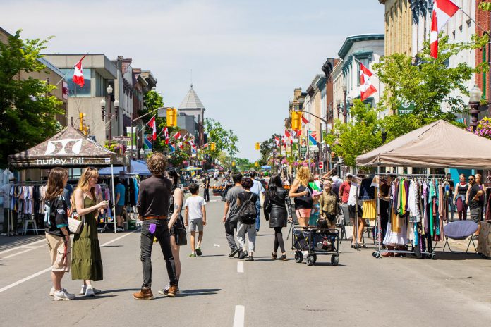 During the Second Saturday Sidewalk Sales organized by the Peterborough Downtown Business Improvement Area (DBIA) on June 13, July 11, August 8, and September 12, 2026, a portion of George Street will be closed to motor vehicles from Hunter Street in the north to Simcoe Street in the south to create expanded pedestrian space for shopping, dining, live entertainment, family-friendly activities, and more. (Photo courtesy of Peterborough DBIA) During the Second Saturday Sidewalk Sales organized by the Peterborough Downtown Business Improvement Area (DBIA) on June 13, July 11, August 8, and September 12, 2026, a portion of George Street will be closed to motor vehicles from Hunter Street in the north to Simcoe Street in the south to create expanded pedestrian space for shopping, dining, live entertainment, family-friendly activities, and more. (Photo courtesy of Peterborough DBIA)