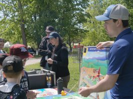 Ontario Power Generation facilitated a guest activity centre at the 24th annual Peterborough Children's Water Festival, which saw around 1,400 children in grades two to five participate in immersive educational experiences at Riverview Park and Zoo on May 27 and 28, 2026. Students are pictured here learning how water can generate power. (Photo: Yvonne Hollandy / GreenUP)