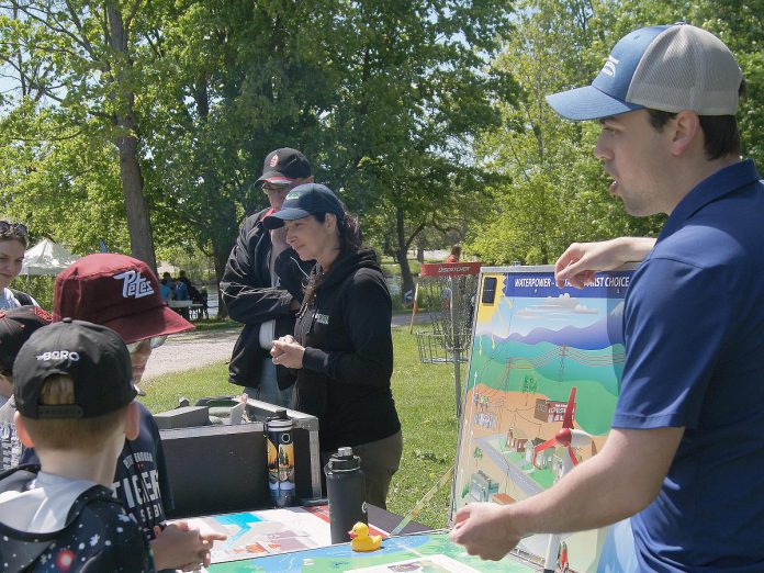 Ontario Power Generation facilitated a guest activity centre at the 24th annual Peterborough Children's Water Festival, which saw around 1,400 children in grades two to five participate in immersive educational experiences at Riverview Park and Zoo on May 27 and 28, 2026. Students are pictured here learning how water can generate power. (Photo: Yvonne Hollandy / GreenUP)
