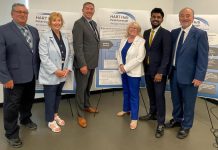 Community leaders and representatives of municipal and provincial governments gathered at the Miskin Law Community Complex on June 26, 2026 to mark the launch of the Homelessness and Addictions Recovery Treatment (HART) Hub in Peterborough. Pictured are Trent Lakes mayor Terry Lambshead, Haliburton-Kawartha Lakes-Brock MPP Laurie Scott, Peterborough-Kawartha MPP Dave Smith, Peterborough County warden Bonnie Clark, Scarborough-Rouge Park MPP and associate minister of mental health and addictions Vijay Thanigasalam, and Selwyn Township deputy mayor Ron Black, who is also board chair of the Four Counties Addictions Services Team (Fourcast), the lead organization for the HART Hub. (Photo courtesy of Ron Black)