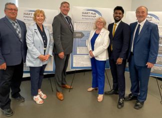 Community leaders and representatives of municipal and provincial governments gathered at the Miskin Law Community Complex on June 26, 2026 to mark the launch of the Homelessness and Addictions Recovery Treatment (HART) Hub in Peterborough. Pictured are Trent Lakes mayor Terry Lambshead, Haliburton-Kawartha Lakes-Brock MPP Laurie Scott, Peterborough-Kawartha MPP Dave Smith, Peterborough County warden Bonnie Clark, Scarborough-Rouge Park MPP and associate minister of mental health and addictions Vijay Thanigasalam, and Selwyn Township deputy mayor Ron Black, who is also board chair of the Four Counties Addictions Services Team (Fourcast), the lead organization for the HART Hub. (Photo courtesy of Ron Black)