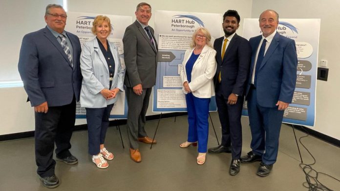 Community leaders and representatives of municipal and provincial governments gathered at the Miskin Law Community Complex on June 26, 2026 to mark the launch of the Homelessness and Addictions Recovery Treatment (HART) Hub in Peterborough. Pictured are Trent Lakes mayor Terry Lambshead, Haliburton-Kawartha Lakes-Brock MPP Laurie Scott, Peterborough-Kawartha MPP Dave Smith, Peterborough County warden Bonnie Clark, Scarborough-Rouge Park MPP and associate minister of mental health and addictions Vijay Thanigasalam, and Selwyn Township deputy mayor Ron Black, who is also board chair of the Four Counties Addictions Services Team (Fourcast), the lead organization for the HART Hub. (Photo courtesy of Ron Black)