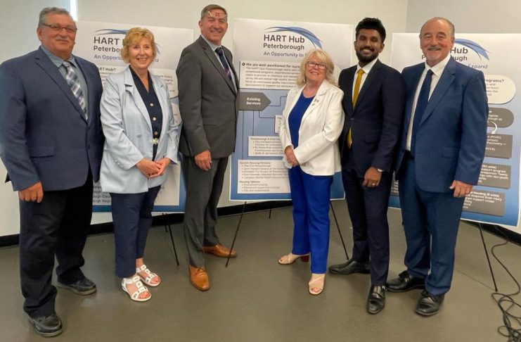 Community leaders and representatives of municipal and provincial governments gathered at the Miskin Law Community Complex on June 26, 2026 to mark the launch of the Homelessness and Addictions Recovery Treatment (HART) Hub in Peterborough. Pictured are Trent Lakes mayor Terry Lambshead, Haliburton-Kawartha Lakes-Brock MPP Laurie Scott, Peterborough-Kawartha MPP Dave Smith, Peterborough County warden Bonnie Clark, Scarborough-Rouge Park MPP and associate minister of mental health and addictions Vijay Thanigasalam, and Selwyn Township deputy mayor Ron Black, who is also board chair of the Four Counties Addictions Services Team (Fourcast), the lead organization for the HART Hub. (Photo courtesy of Ron Black)