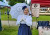 Hystory Entertainment founder Jacquie Barker at the Freshwater Summit Festival in Coboconk on June 20, 2026, promoting her debut Victorian murder mystery experience "Murder at Birchwood Estate" at the Coboconk Community Centre on July 10 and 11. The interactive event will feature a three-course meal, a silent auction, and an opportunity to learn about local history during the Victorian era. (Photo courtesy of Hystory Entertainment)