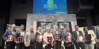 The nine Peterborough business leaders who were inducted into the 11th annual JA Business Hall of Fame at The Venue in downtown Peterborough on June 4, 2026. As the ceremony, Junior Achievement of Northern and Eastern Ontario (JA-NEO) also announced that the late late John McNutt, the longtime CEO and president of JA-NEO and executive director of the Council for Persons with Disabilities, along with his wife of 47 years, Sheryl Hopkins, would also be inducted into the JA Business Hall of Fame. (Photo courtesy of JA-NEO)
