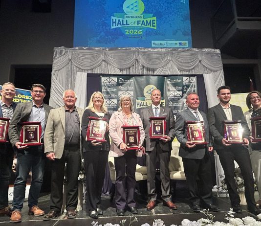 The nine Peterborough business leaders who were inducted into the 11th annual JA Business Hall of Fame at The Venue in downtown Peterborough on June 4, 2026. As the ceremony, Junior Achievement of Northern and Eastern Ontario (JA-NEO) also announced that the late late John McNutt, the longtime CEO and president of JA-NEO and executive director of the Council for Persons with Disabilities, along with his wife of 47 years, Sheryl Hopkins, would also be inducted into the JA Business Hall of Fame. (Photo courtesy of JA-NEO)