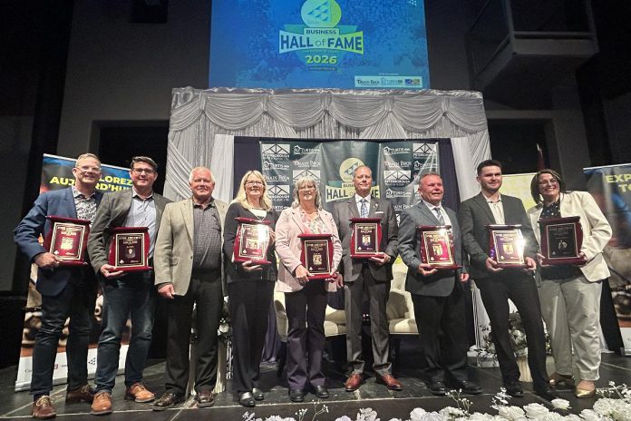 The nine Peterborough business leaders who were inducted into the 11th annual JA Business Hall of Fame at The Venue in downtown Peterborough on June 4, 2026. As the ceremony, Junior Achievement of Northern and Eastern Ontario (JA-NEO) also announced that the late late John McNutt, the longtime CEO and president of JA-NEO and executive director of the Council for Persons with Disabilities, along with his wife of 47 years, Sheryl Hopkins, would also be inducted into the JA Business Hall of Fame. (Photo courtesy of JA-NEO)