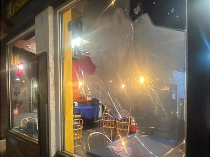 A front window at La Mesita Restaurante at 247 George Street North in downtown Peterborough just north of Sherbrooke was vandalized sometime overnight on June 7, 2026. (Photo: La Mesita Restaurante / Facebook)