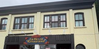 Plywood covers a front window at La Mesita Restaurante at 247 George Street North in downtown Peterborough just north of Sherbrooke after it was vandalized around 2:35 a.m. on June 7, 2026. (Photo supplied to kawarthaNOW)