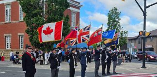 The Royal Canadian Legion Colour Party honouring the Veterans Memorial Crosswalk in downtown Lakefield during an official unveiling ceremony on June 20, 2026. Lakefield Legion Branch 77, Peterborough County, and Selwyn Township collaborated on the creation of the crosswalk, which also commemorates the 100th anniversary of the Lakefield Legion, one of the earliest chartered branches. (Photo: Selwyn Township)