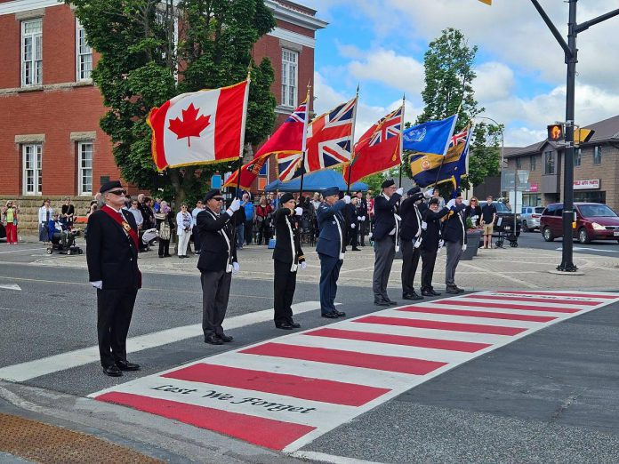 The Royal Canadian Legion Colour Party honouring the Veterans Memorial Crosswalk in downtown Lakefield during an official unveiling ceremony on June 20, 2026. Lakefield Legion Branch 77, Peterborough County, and Selwyn Township collaborated on the creation of the crosswalk, which also commemorates the 100th anniversary of the Lakefield Legion, one of the earliest chartered branches. (Photo: Selwyn Township) The Royal Canadian Legion Colour Party honouring the Veterans Memorial Crosswalk in downtown Lakefield during an official unveiling ceremony on June 20, 2026. Lakefield Legion Branch 77, Peterborough County, and Selwyn Township collaborated on the creation of the crosswalk, which also commemorates the 100th anniversary of the Lakefield Legion, one of the earliest chartered branches. (Photo: Selwyn Township)