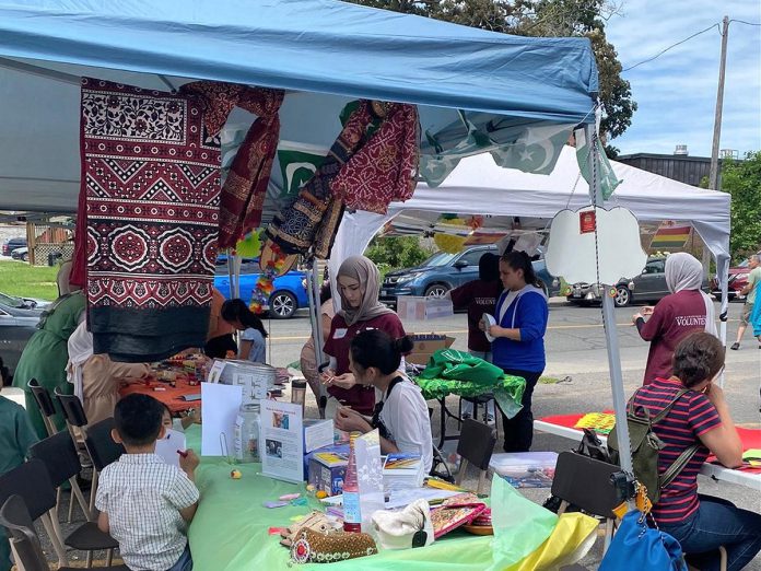 During the Block Party event held during the 2024 Canadian Multicultural Festival hosted by the New Canadians Centre, clients and volunteers of the organization set up vendor booths inviting visitors to learn more about countries around the world, including Saima Sarfraz's booth about her home country of Pakistan. (Photo courtesy of Saima Sarfraz)