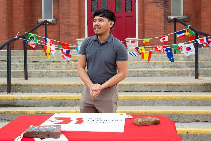 During an announcement on June 10, 2026 of the fifth annual Canadian Multicultural Festival presented by the New Canadians Centre, Ivan Etcuban discusses plans for a multicultural fashion show he is coordinating with Greatchen Griffiths as part of the Block Party that wraps up the festival on Saturday, June 26. (Photo: Jordan Lyall / kawarthaNOW)