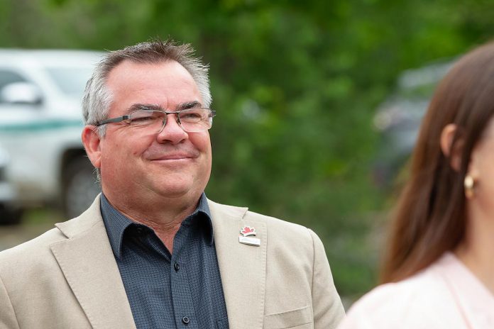 The City of Peterborough's commissioner of infrastructure, planning and growth management Blair Nelson smiles as Peterborough mayor Jeff Leal acknowledges his work as a major behind-the-scenes player in the opening of the new Peterborough Visitor Centre during a media event on June 25, 2026. (Photo: Jordan Lyall / kawarthaNOW)