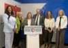 Ontario's rural affairs minister Lisa Thompson (behind lectern) during an announcement in Peterborough on June 15, 2026 of $260,305.50 in provincial funding to support rural development. Also pictured are representatives of the five organizations and municipalities receiving the funding (left to right): Innovation Cluster board chair Nicole Stephenson, Peterborough County warden Bonnie Clark, City of Peterborough mayor Jeff Leal, Farms at Work community farm planner Andrea Hicks, and Community Care Peterborough operations director Catherine Pink. Absent from the photo is Peterborough-Kawartha Dave Smith. (Photo: Bethan Bates / kawarthaNOW)