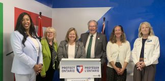 Ontario's rural affairs minister Lisa Thompson (behind lectern) during an announcement in Peterborough on June 15, 2026 of $260,305.50 in provincial funding to support rural development. Also pictured are representatives of the five organizations and municipalities receiving the funding (left to right): Innovation Cluster board chair Nicole Stephenson, Peterborough County warden Bonnie Clark, City of Peterborough mayor Jeff Leal, Farms at Work community farm planner Andrea Hicks, and Community Care Peterborough operations director Catherine Pink. Absent from the photo is Peterborough-Kawartha Dave Smith. (Photo: Bethan Bates / kawarthaNOW)