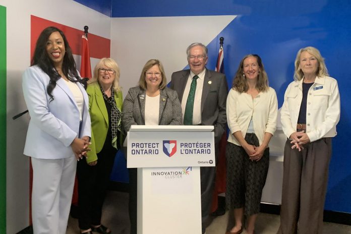 Ontario's rural affairs minister Lisa Thompson (behind lectern) during an announcement in Peterborough on June 15, 2026 of $260,305.50 in provincial funding to support rural development. Also pictured are representatives of the five organizations and municipalities receiving the funding (left to right): Innovation Cluster board chair Nicole Stephenson, Peterborough County warden Bonnie Clark, City of Peterborough mayor Jeff Leal, Farms at Work community farm planner Andrea Hicks, and Community Care Peterborough operations director Catherine Pink. Absent from the photo is Peterborough-Kawartha Dave Smith. (Photo: Bethan Bates / kawarthaNOW)