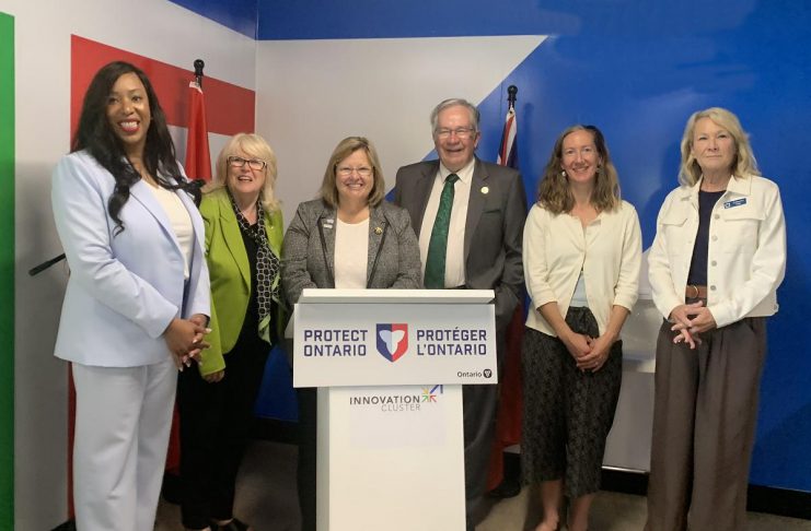 Peterborough’s Innovation Cluster among five local recipients of over $260,000 in Ontario rural development funding Ontario's rural affairs minister Lisa Thompson (behind lectern) during an announcement in Peterborough on June 15, 2026 of $260,305.50 in provincial funding to support rural development. Also pictured are representatives of the five organizations and municipalities receiving the funding (left to right): Innovation Cluster board chair Nicole Stephenson, Peterborough County warden Bonnie Clark, City of Peterborough mayor Jeff Leal, Farms at Work community farm planner Andrea Hicks, and Community Care Peterborough operations director Catherine Pink. Absent from the photo is Peterborough-Kawartha Dave Smith. (Photo: Bethan Bates / kawarthaNOW)
